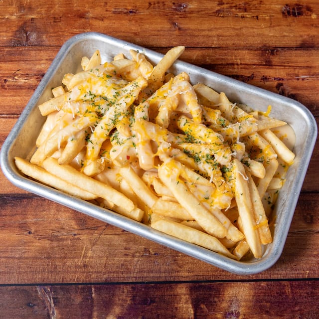 Spicy White Queso Fries or Tots.